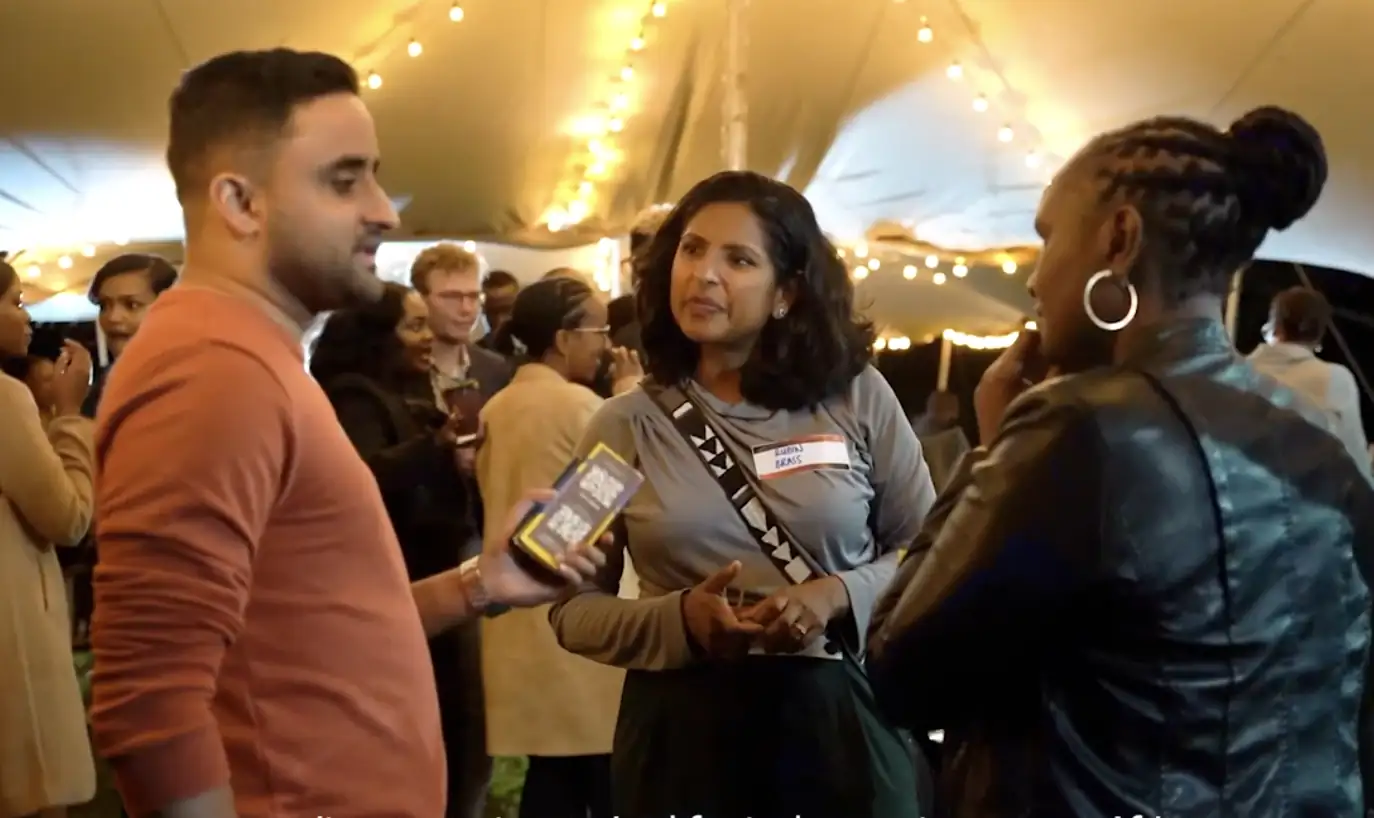 Attendees networking and talking at an evening corporate event