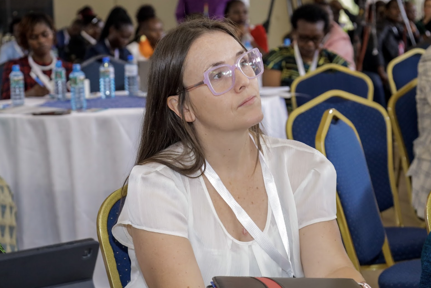 Close-up of an attendee listening at a corporate conference