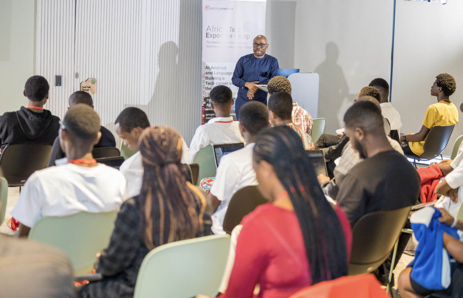 Man presenting to an audience at an African Tech Expo