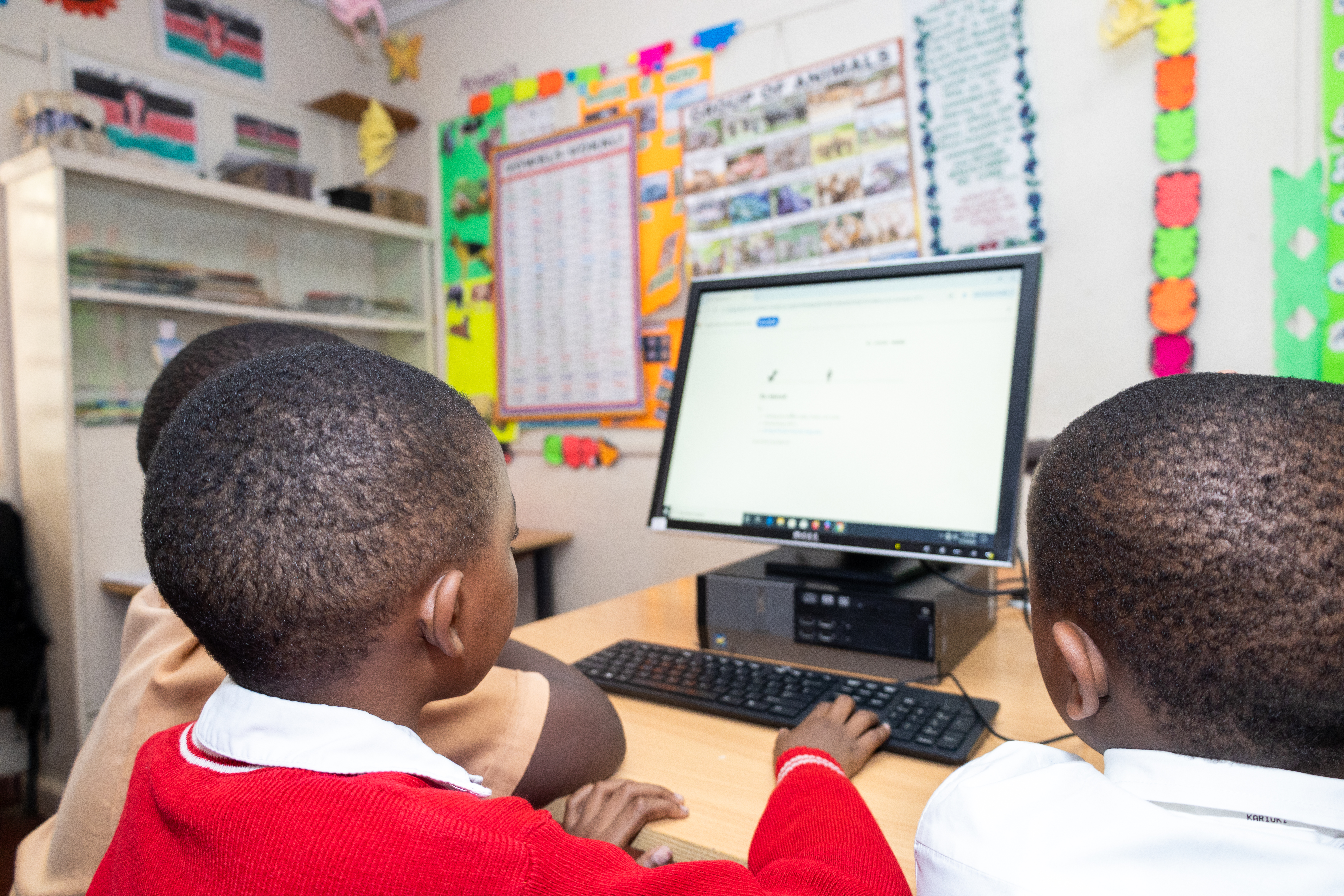 Two men in suits shaking hands at an Equity Bank event